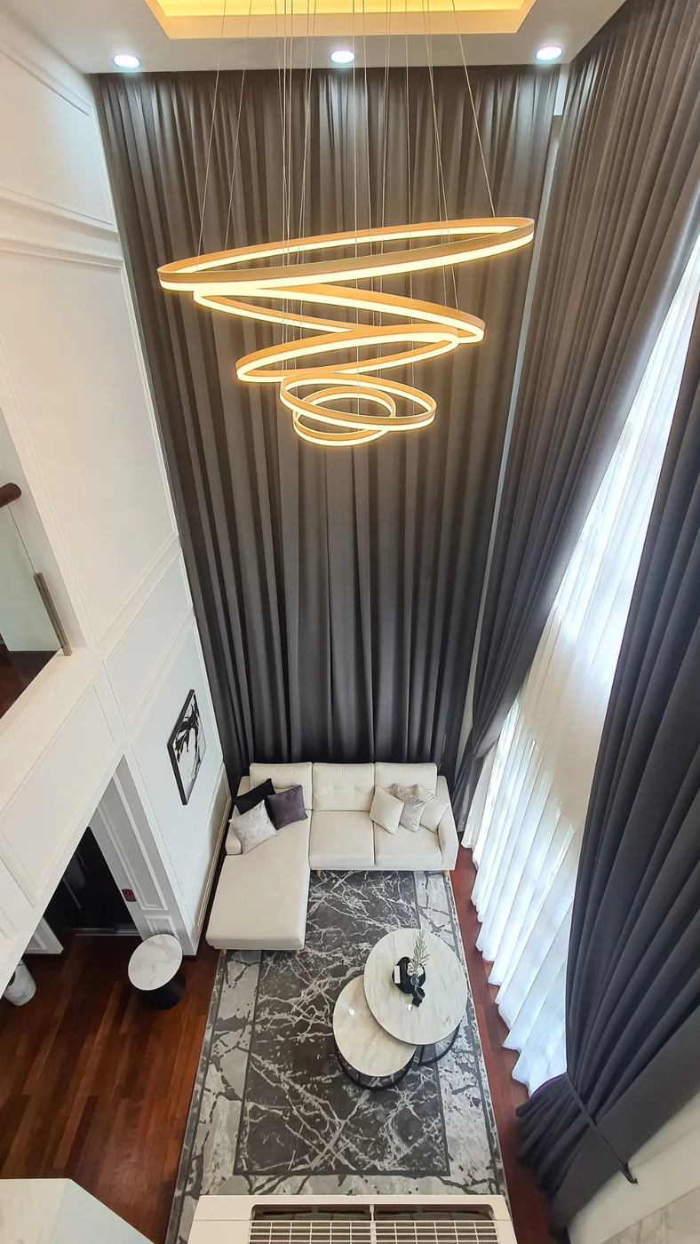Two-storey living void viewed from the upper floor at TTDI Heights