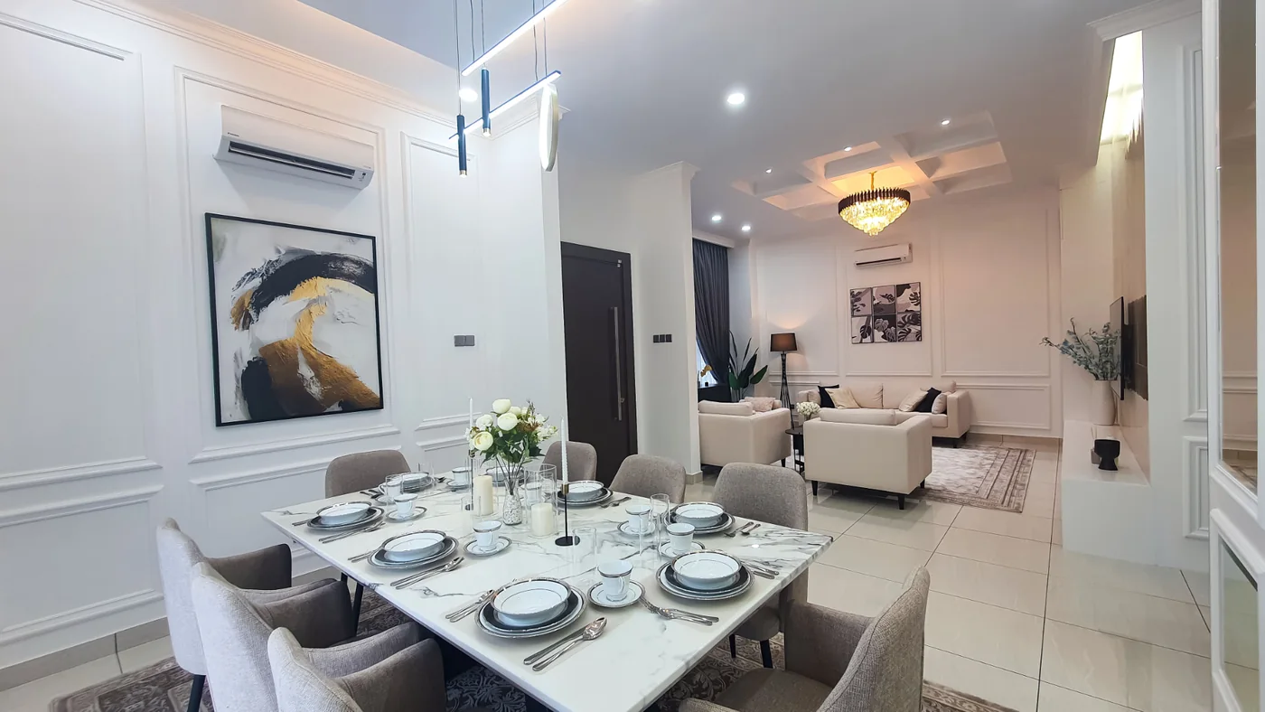 Dining area of the TTDI Heights bungalow with the open living area beyond