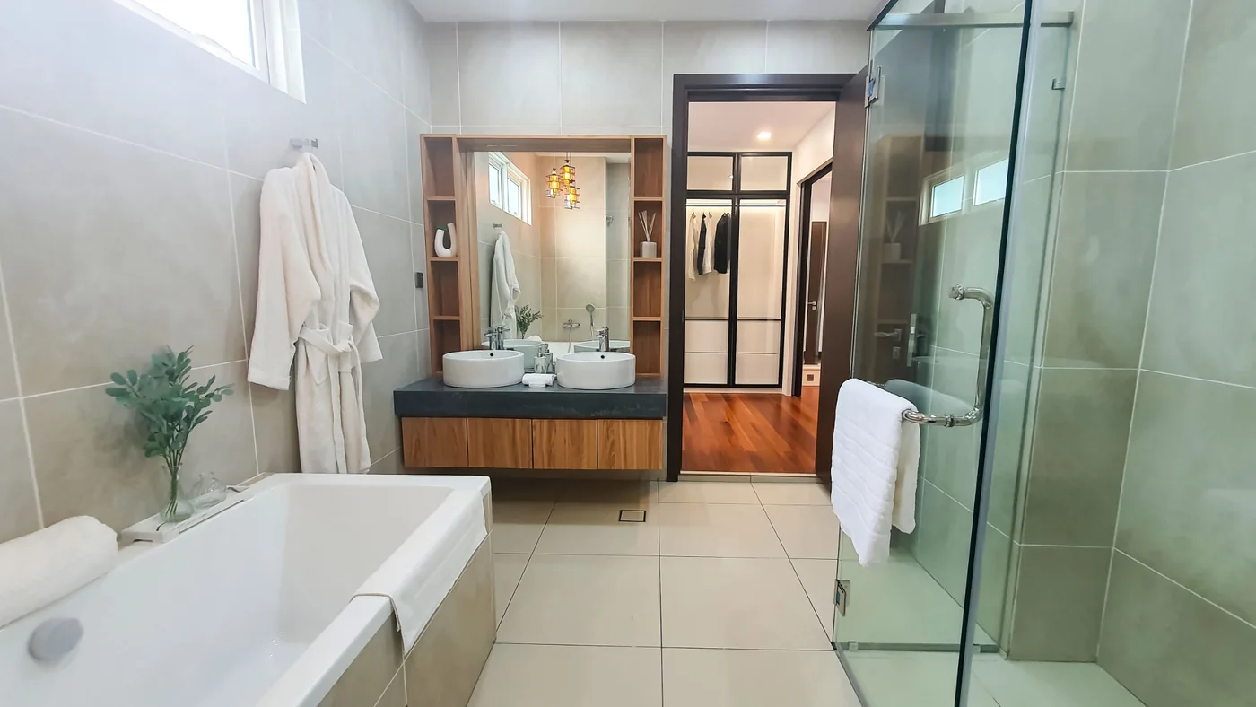 Master bathroom with bathtub and glass shower at TTDI Heights